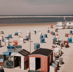 Colorful beach cabins on the sandy shores of Borkum, Germany.