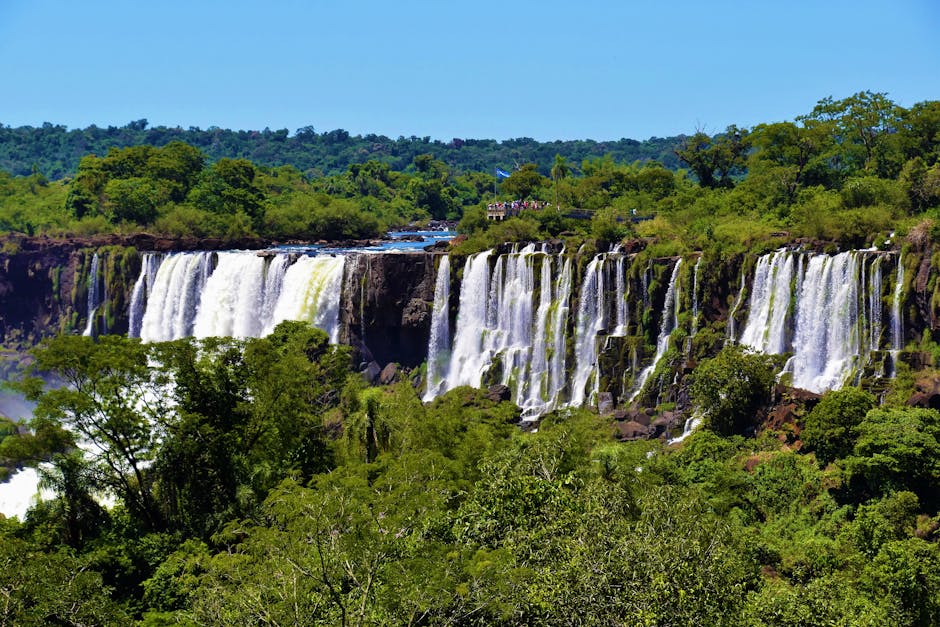 Lush greenery and cascading waters of Iguazu Falls, a natural wonder in Argentina's Misiones Province.