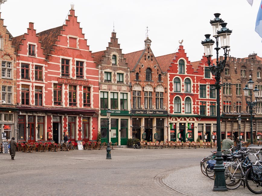 Capture of colorful medieval buildings in Bruges, showcasing rich Flemish architecture.
